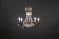 The classic Empire 4 crystal chandelier with candle placements brings a timelessly and elegant atmosphere to even the larger spaces.